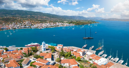 Panoramic view over the town of Poros island to the Saronic Gulf and the village Galatas on the mainland, Greeceの写真素材
