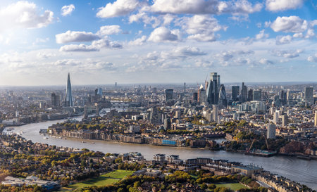 High panorama of the London skyline along the river Thames from London Bridge until the City during a sunny day, United Kingdomの写真素材