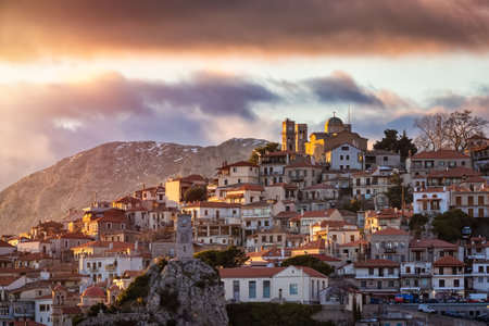 The popular village of Arachova, Boiotia, Greece, at the slopes of Parnassus mountain during a golden winter sunsetの写真素材