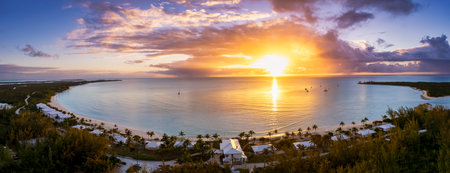 Panoramic aerial view of the beautiful Santa Maria Beach at Galliot Cay, Long island, Caribbean, Bahamas during sunset timeの写真素材