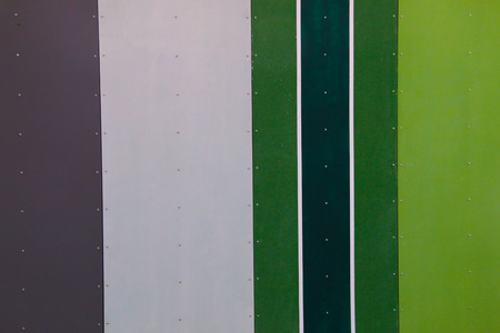 A wall of many different colors, mainly green shades
