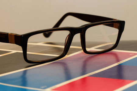 Close-up of glasses on a colorful test printの写真素材