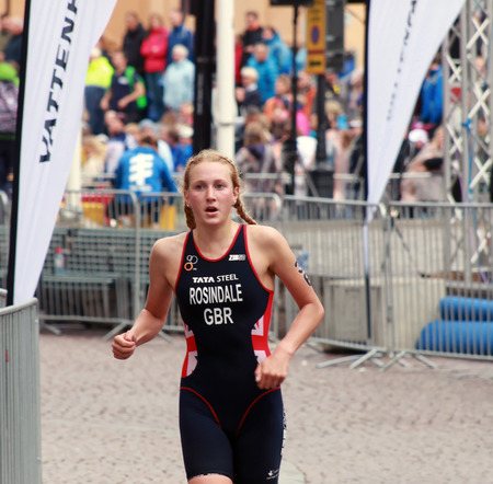 STOCKHOLM - AUG 23, 2014: Triathlete Lois Rosindale (GBR) running in the triathlonin the Women's ITU World Triathlon series event August 23, 2014 in Stockholm, Swedenのeditorial素材