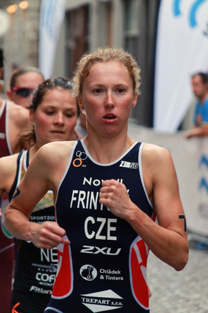 STOCKHOLM - AUG 23, 2014: Triathlete Vendula Frintova (CZE) first in a group of runners in the Women's ITU World Triathlon series event Aug 23, 2014 in Stockholm, Swedenのeditorial素材