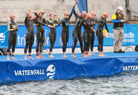 STOCKHOLM - AUG 23, 2014: Warming up before the start in the Women's ITU World Triathlon series event Aug 23, 2014 in Stockholm, Swedenのeditorial素材