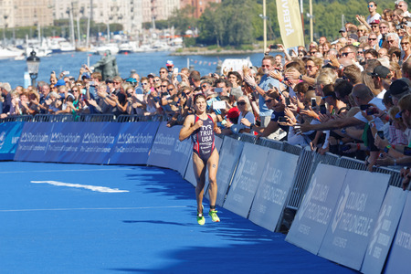 STOCKHOLM - AUG 22, 2015: A happy Sarah True a few yards before winning the Women's ITU World Triathlon series event August 22, 2015 in Stockholm, Swedenのeditorial素材