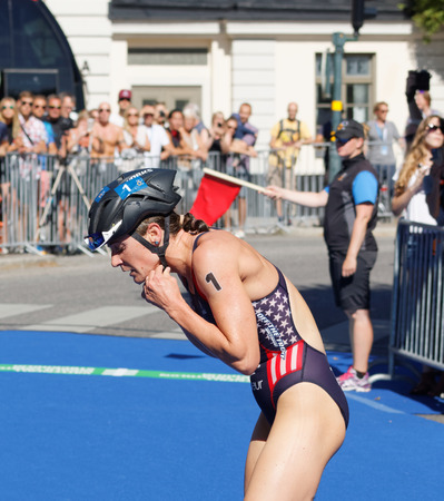 STOCKHOLM - AUG 22, 2015: Close-up of Katie Zaferes (USA) is the lead in the transition zone from swimming to cycling in the Women's ITU World Triathlon series event August 22, 2015 in Stockholm, Swedenのeditorial素材