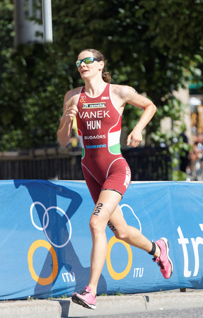 STOCKHOLM - AUG 22, 2015: Triathlete Margit Vanek running in the Women's ITU World Triathlon series event August 22, 2015 in Stockholm, Swedenのeditorial素材