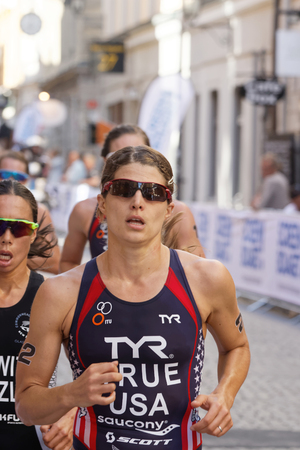 STOCKHOLM - AUG 22, 2015: Close-up of triathlete Sarah True running, followed by Andrea Hewitt and Katie Zaferes in the Women's ITU World Triathlon series event August 22, 2015 in Stockholm, Swedenのeditorial素材