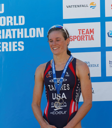 STOCKHOLM - AUG 22, 2015: Katie Zaferes on the winner's with silver medal stand during the prize ceremny in the Women's ITU World Triathlon series event August 22, 2015 in Stockholm, Swedenのeditorial素材