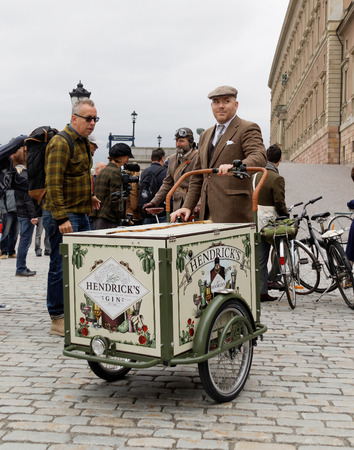 STOCKHOLM - SEPT 19, 2015: Man sitting on a cycle used by gophers wearing old fashioned brown tweed clothes in the Bike in Tweed event September 19, 2015 in Stockholm, Swedenのeditorial素材