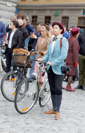 STOCKHOLM - SEPT 19, 2015: Group of people wearing old fashioned tweed clothes and bikes in the Bike in Tweed event September 19, 2015 in Stockholm, Swedenのeditorial素材