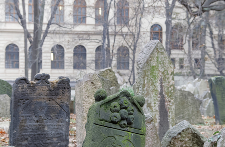 PRAGUE, CZECHIA - DEC 04, 2015: Old Jewish cemetery with lots of ancient headstones and a church in the background. December 04, 2015 in Prague, Czechiaのeditorial素材