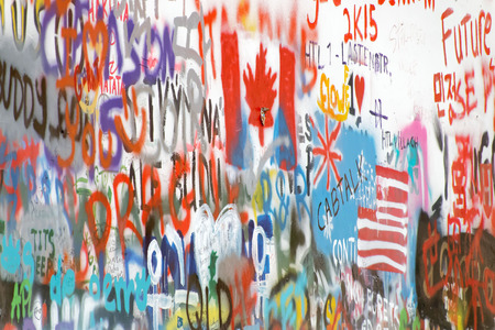 PRAGUE, CZECHIA - DEC 05, 2015: The colorful public John Lennon Wall where there is a continous...