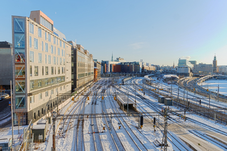 STOCKHOLM, SWEDEN - JAN 16, 2016: View of the snowy marshalling yard where the train arrives to Stockholm a cold beautiful day, January 16, 2015 in Stockholm, Swedenのeditorial素材