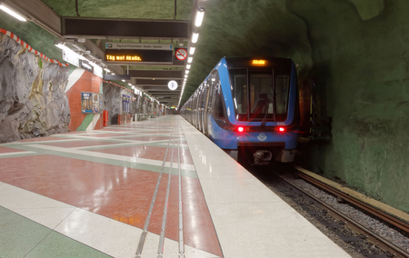 STOCKHOLM - JAN 28, 2016: Train in the beautiful and art decorated subway station Kungstradgarden in Stockholm.  January 28, 2016 in Stockholm, Swedenのeditorial素材