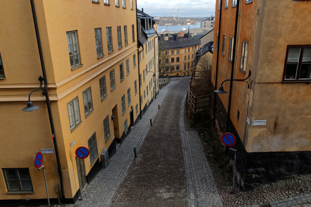 Narrow cobblestone alley Bastugatan and old houses in central Stockholm.の写真素材