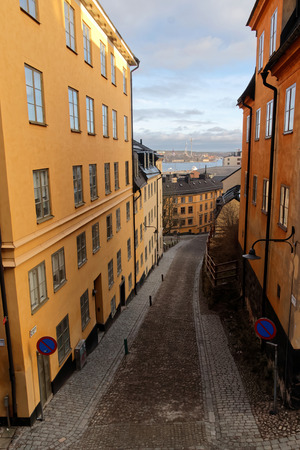 Narrow cobblestone alley Bastugatan and old houses in central Stockholm.の写真素材