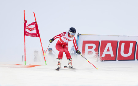 STOCKHOLM, SWEDEN - FEB 23, 2016: One female skiier in red at the FIS Alpine Ski World Cup - city event February 23, 2016, Stockholm, Swedenのeditorial素材