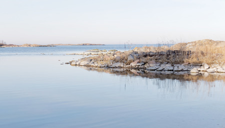 Archipelago, calm sea and rocks  a sunny morning in spring in Swedenの写真素材