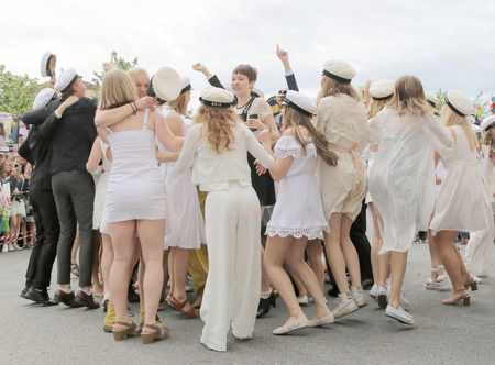 STOCKHOLM, SWEDEN - JUN 10, 2015: Group of happy teenagers dancing at the graduation after finishing high school at the school Globala gymnasiet, June 10, 2015, Stockholm, Swedenのeditorial素材