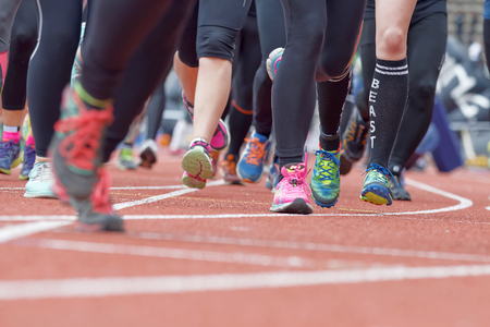 STOCKHOLM, SWEDEN - MAY 14, 2016: Colorful running feet and legs after the start in the obstacle race Tough Viking Event in Sweden, April 14, 2016のeditorial素材