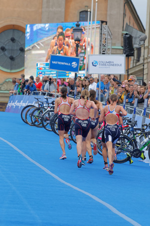 STOCKHOLM - JUL 02, 2016: Rear view of group of running triathlete in the transition zone in the Women's ITU World Triathlon series event July 02, 2016 in Stockholm, Swedenのeditorial素材