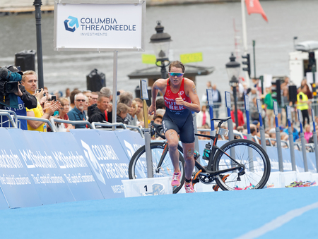 STOCKHOLM - JUL 02, 2016: Leading triathlete Flora Duffy running in the transition zone in the Women's ITU World Triathlon series event July 02, 2016 in Stockholm, Swedenのeditorial素材