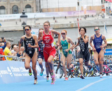 STOCKHOLM - JUL 02, 2016: Group of triathletes running in the transition zone in the Women's ITU World Triathlon series event July 02, 2016 in Stockholm, Swedenのeditorial素材