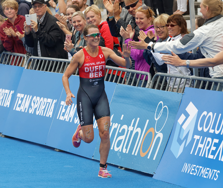 STOCKHOLM - JUL 02, 2016: Winning triathlete Flora Duffy (BER) running at the finish in the Women's ITU World Triathlon series event July 02, 2016 in Stockholm, Swedenのeditorial素材