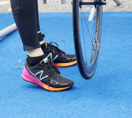 STOCKHOLM - JUL 02, 2016: Closeup of a professional cycle and shoes in the Women's ITU World Triathlon series event July 02, 2016 in Stockholm, Swedenのeditorial素材