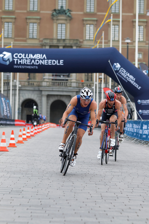 STOCKHOLM, SWEDEN - JUL 02, 2016: Group of male triathlete cyclists, Kristian Blummenfelt (NOR)  and competitors in the Men's ITU World Triathlon series event July 02, 2016 in Stockholm, Swedenのeditorial素材