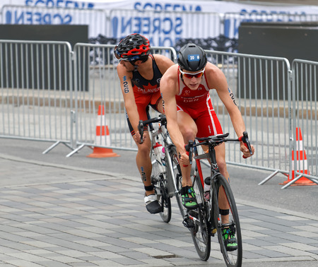 STOCKHOLM, SWEDEN - JUL 02, 2016: Male triathlete cyclists Andreas Schilling and Xavier Grenier-Talavera in the Men's ITU World Triathlon series event July 02, 2016 in Stockholm, Swedenのeditorial素材