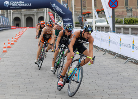 STOCKHOLM, SWEDEN - JUL 02, 2016: Group of male triathlete cyclists Shachar Sagiv (ISR), Jumpei Furova (JPN) and competitors in the Men's ITU World Triathlon series event July 02, 2016 in Stockholm, Swedenのeditorial素材