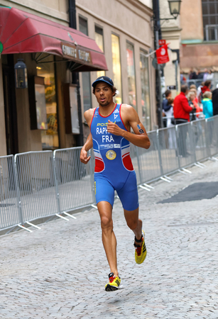 STOCKHOLM - JUL 02, 2016: Running triathlete Aurelien Raphael (FRA) in the old town of Stockholm in the Men's ITU World Triathlon series event July 02, 2016 in Stockholm, Swedenのeditorial素材