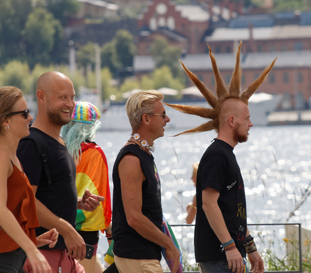 STOCKHOLM, SWEDEN - JUL 30, 2016: Group of med with funny hair cut in the Pride parade July 30, 2016 in Stockholm, Swedenのeditorial素材