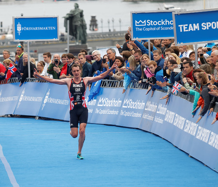 STOCKHOLM - JUL 02, 2016: Triathlete Alistair Brownlee winning the race and raising his arms in the Men's ITU World Triathlon series event July 02, 2016 in Stockholm, Swedenのeditorial素材