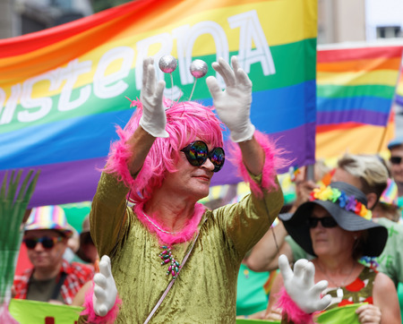 STOCKHOLM, SWEDEN - JUL 30, 2016: Senior transvestite man with a pink wig in the Pride parade July 30, 2016 in Stockholm, Swedenのeditorial素材