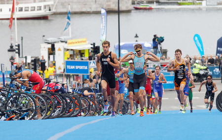 STOCKHOLM - JUL 02, 2016: Tough fight between running triathletes Vanderplancke, Steel, Sagiv and competitors in the Men's ITU World Triathlon series event July 02, 2016 in Stockholm, Swedenのeditorial素材