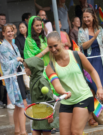 STOCKHOLM, SWEDEN - JUL 30, 2016: Woman playing tennis in the Pride parade July 30, 2016 in Stockholm, Swedenのeditorial素材