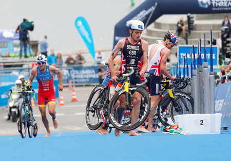 STOCKHOLM - JUL 02, 2016: Triathlete Alistair Brownlee and Fernando Alarza in the transition zone in the Men's ITU World Triathlon series event July 02, 2016 in Stockholm, Swedenのeditorial素材