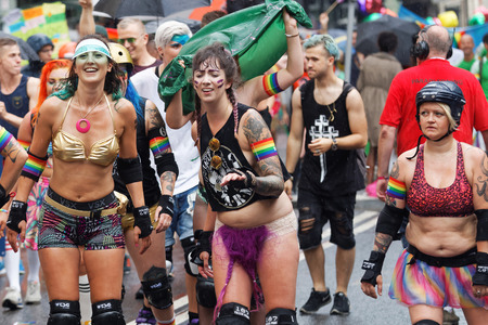 STOCKHOLM, SWEDEN - JUL 30, 2016: Group of roller skating happy girls in spectacular clothes in the Pride parade July 30, 2016 in Stockholm, Swedenのeditorial素材
