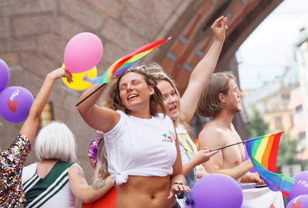 STOCKHOLM, SWEDEN - JUL 30, 2016: Dancing and singing girls and boys in the Pride parade July 30, 2016 in Stockholm, Swedenのeditorial素材