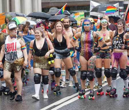 STOCKHOLM, SWEDEN - JUL 30, 2016: Group of roller skating happy girls in spectacular clothes in the Pride parade July 30, 2016 in Stockholm, Swedenのeditorial素材
