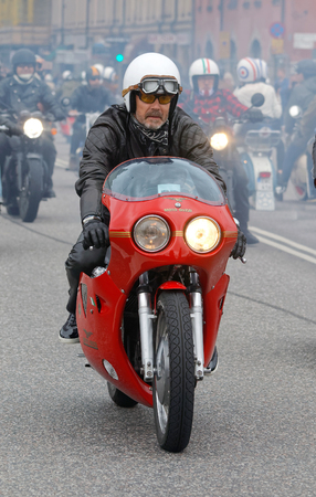 STOCKHOLM, SWEDEN - SEPT 03, 2016: Biker wearing leather clothes on old fashioned motorcycle at the Mods vs Rockers event at the St:Eriks bridge, Stockholm, Sweden, September 02, 2016のeditorial素材