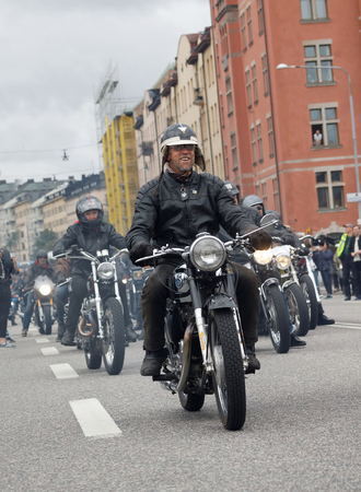 STOCKHOLM, SWEDEN - SEPT 03, 2016: Group of senior bikers on old fashioned motorcycles at the Mods vs Rockers event at the St:Eriks bridge, Stockholm, Sweden, September 02, 2016のeditorial素材