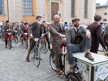 STOCKHOLM - SEPT 24, 2016: Man sitting on a cycle used by gophers wearing old fashioned brown tweed clothes in the Bike in Tweed event September 24, 2016 in Stockholm, Swedenのeditorial素材