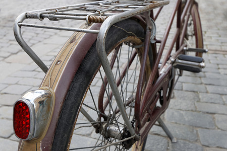 STOCKHOLM - SEPT 24, 2016: Closeup of the wheel of an old brown bicyce in the Bike in Tweed event September 24, 2016 in Stockholm, Swedenのeditorial素材