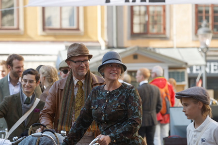 STOCKHOLM - SEPT 24, 2016: Many people in old fashioned clothes in a queue in the Bike in Tweed event September 24, 2016 in Stockholm, Swedenのeditorial素材
