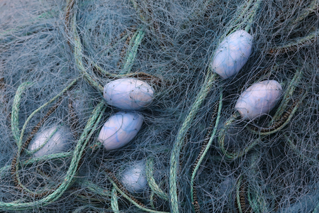Blue fishing net and buoysの写真素材